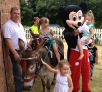 Mickey Mouse posing for pictures with Paddy